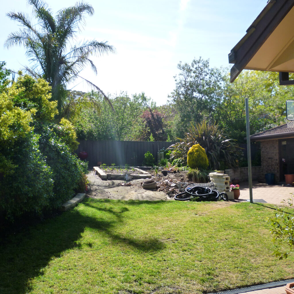 Freestone retaining wall and pool paving before