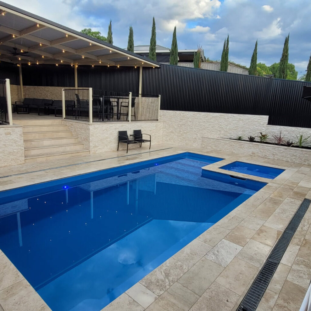 Classic Cream Travertine pool paving and Bookleaf Wall Cladding3