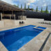 Classic Cream Travertine pool paving and Bookleaf Wall Cladding3